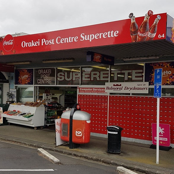 Gray Car in front of the Balmoral Drycleaners Store